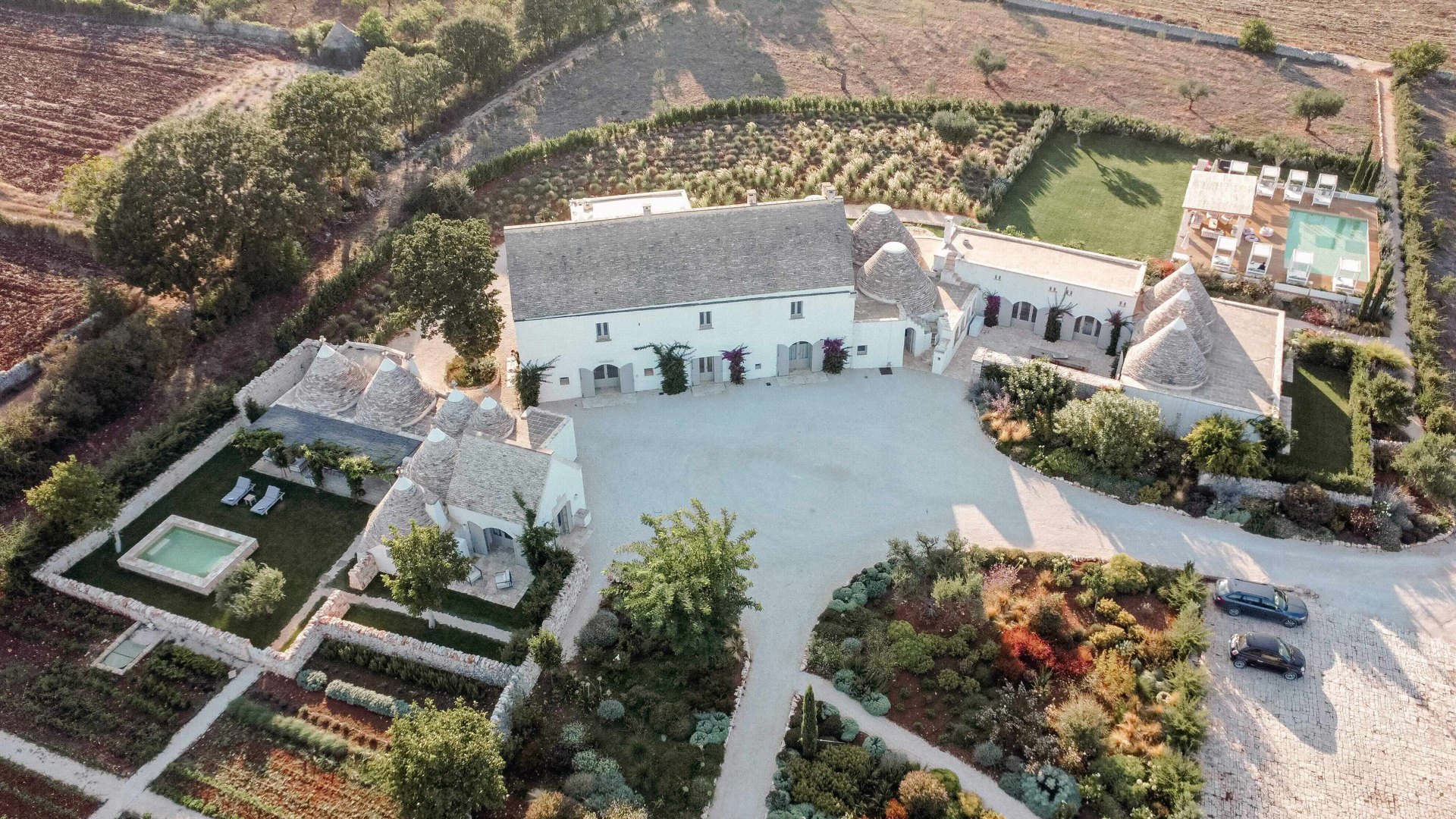 Masseria Pistola, its historic stone buildings and private gardens in the Canale di Pirro, Puglia